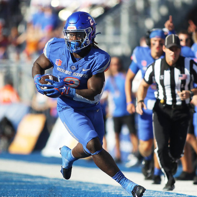 Football game at Boise State University with fans cheering in the stadium